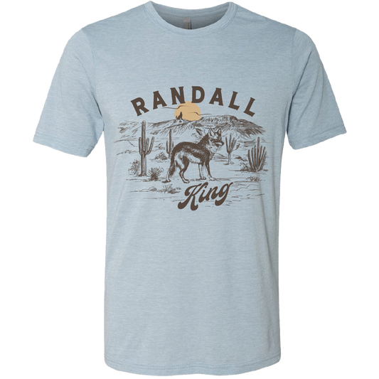 tee-heather light blue-"Randall King"  coyote in desert with sunset